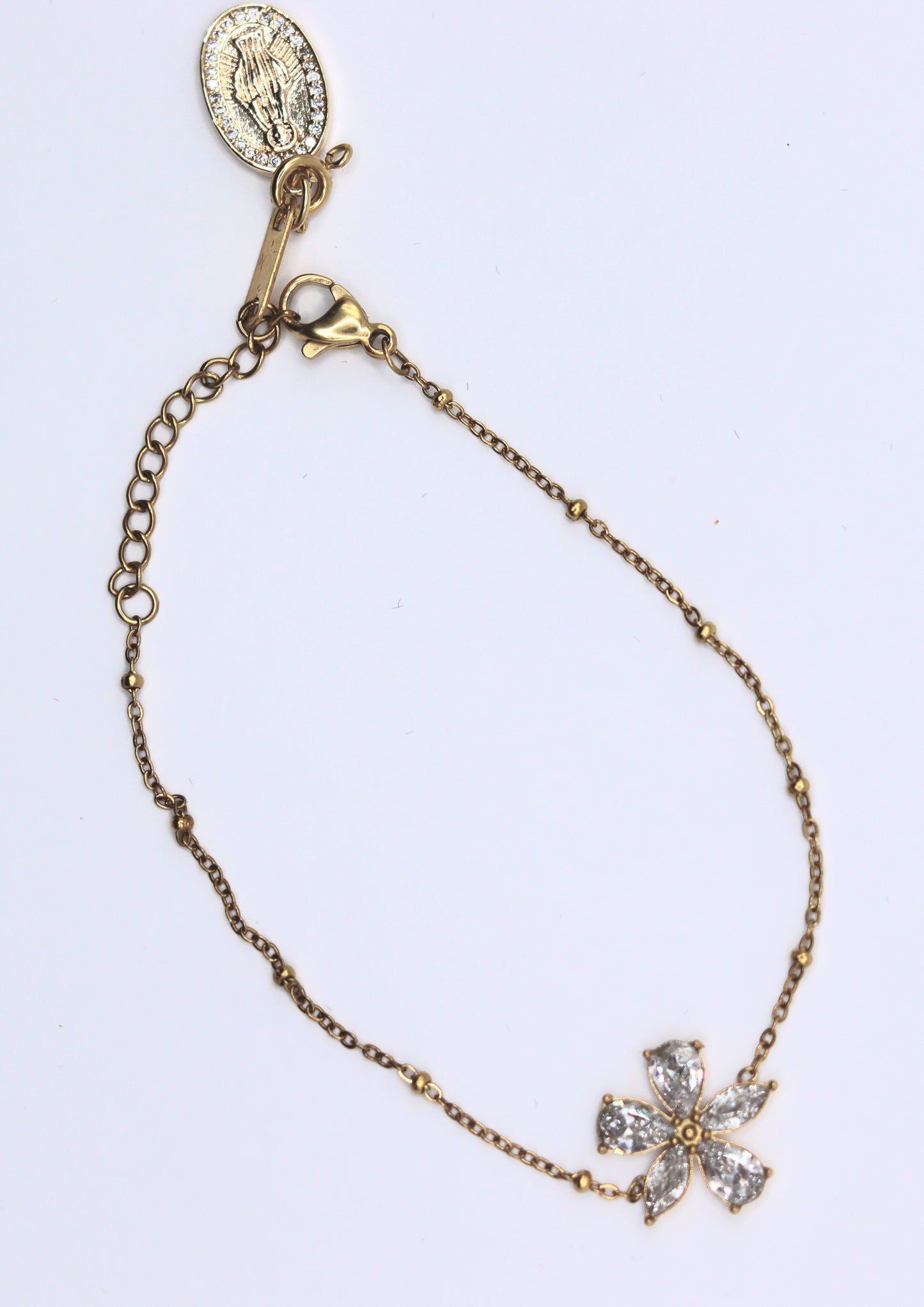 Bracelet orné d'un motif fleur 5 zircons et pendentif médaille Vierge amovible