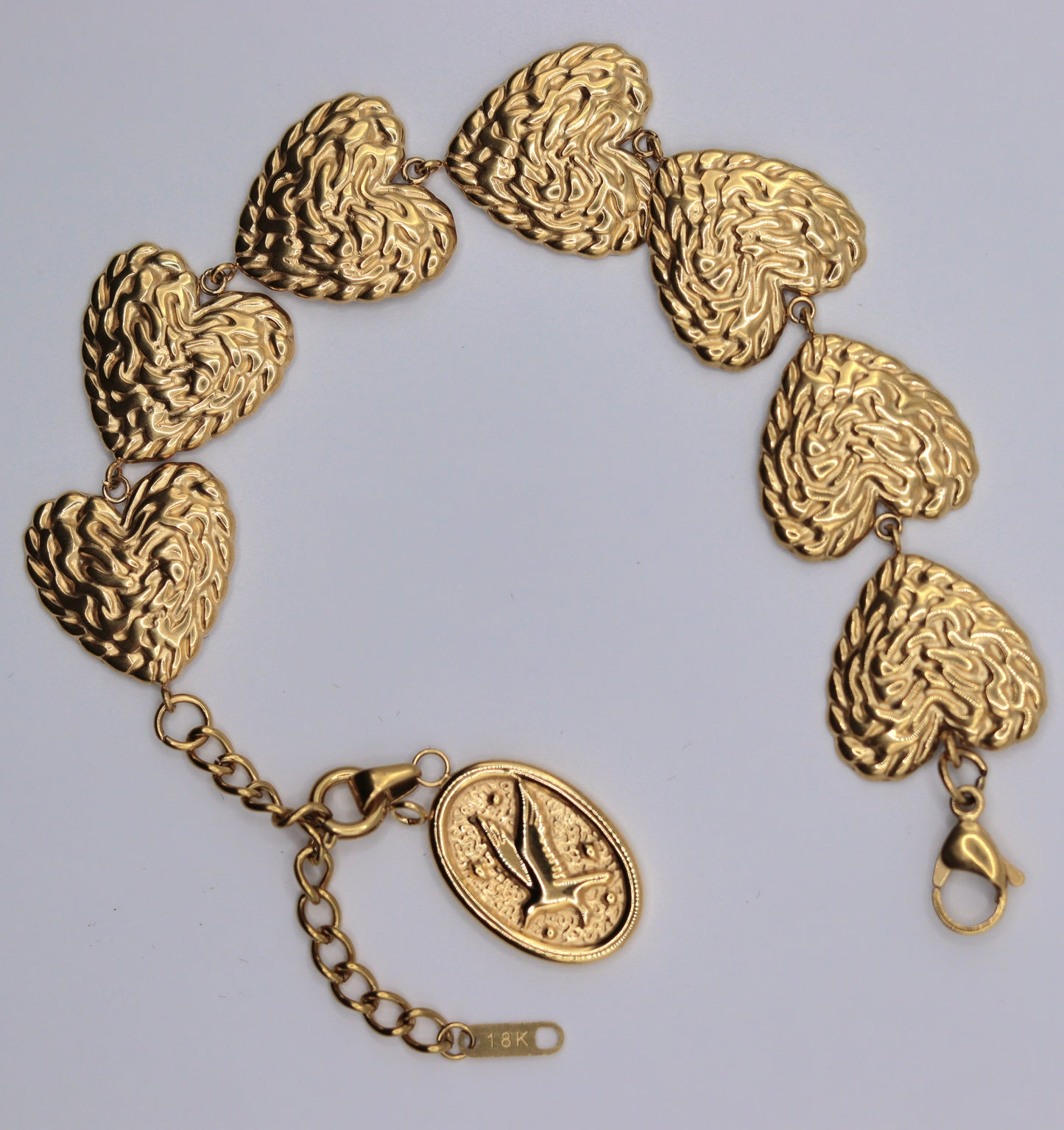 Bracelet doré ou argenté mailles 7 coeurs orné d'un pendentif amovible médaille Colombe Esprit-Saint