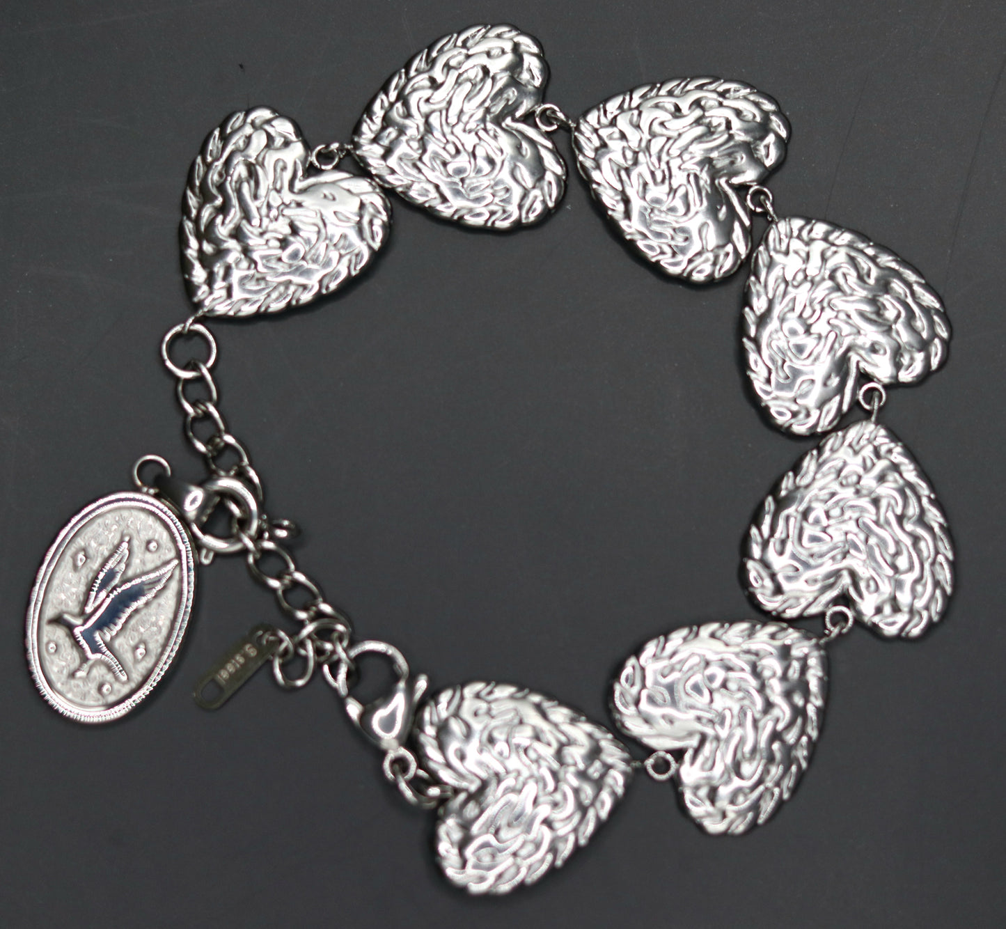 Bracelet doré ou argenté mailles 7 coeurs orné d'un pendentif amovible médaille Colombe Esprit-Saint